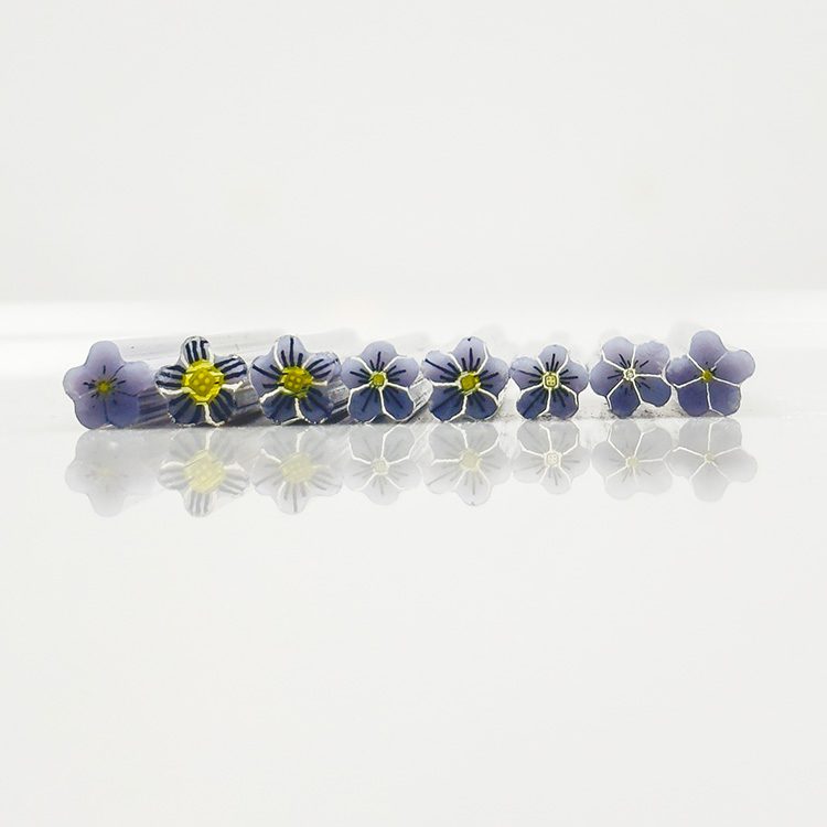 Purple and white violet flower murrine slices standing on edge, Bullseye 90COE