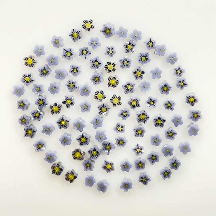 Purple and white violet flower murrine on white background, Bullseye 90COE